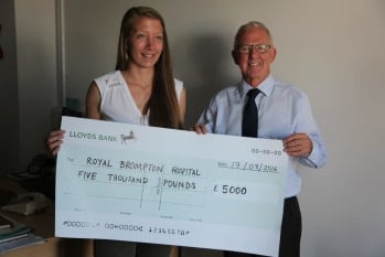 Helen presents Dr Shore with cheque